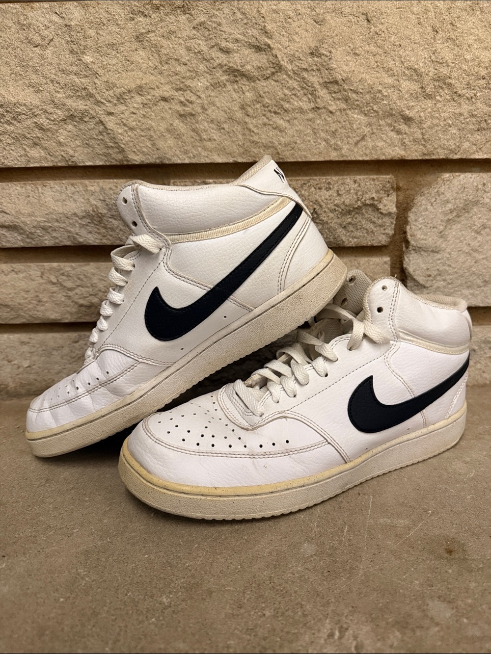 Nike White Mid-Top Sneakers with Black Swoosh